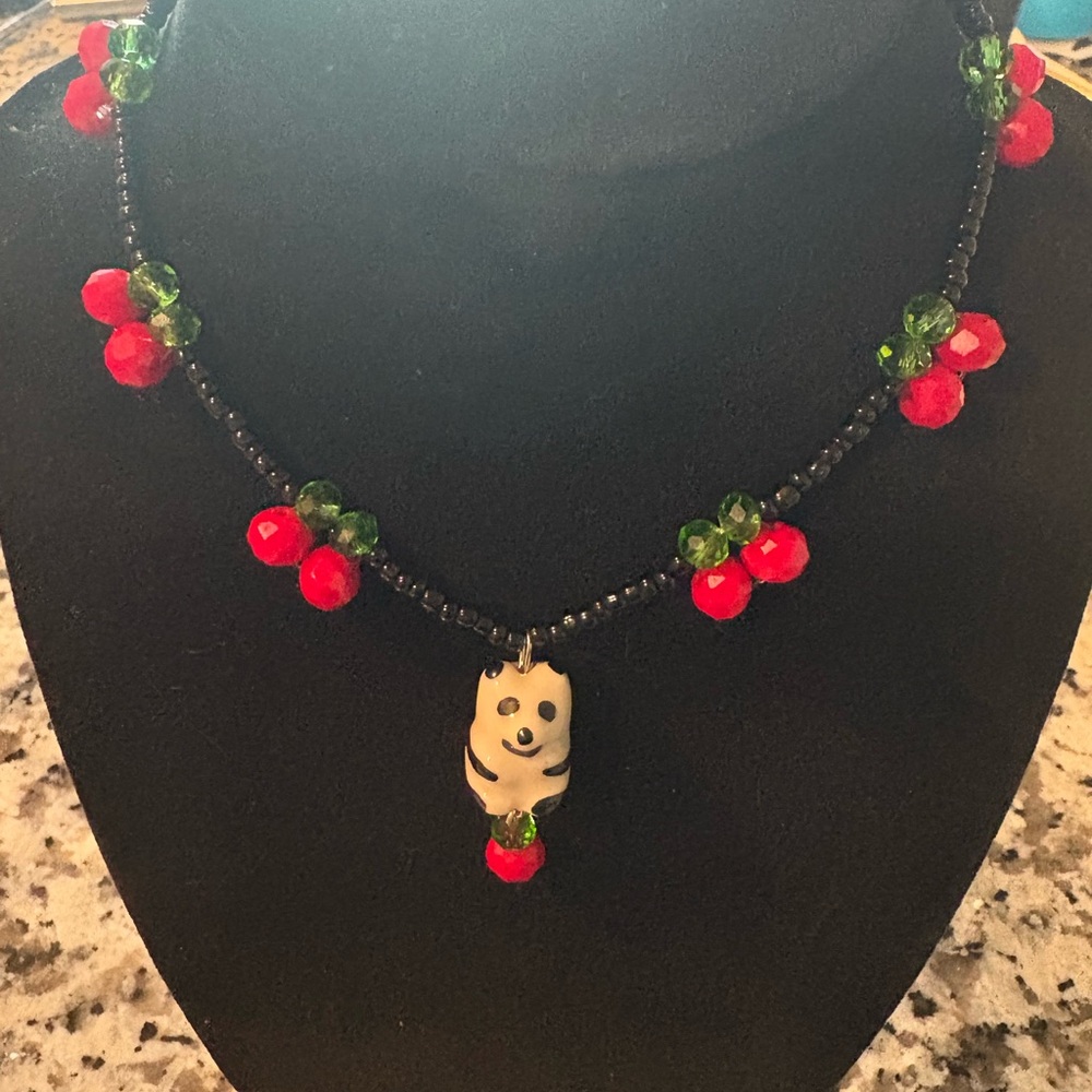 Black Beaded Necklace with Red and Green Accents